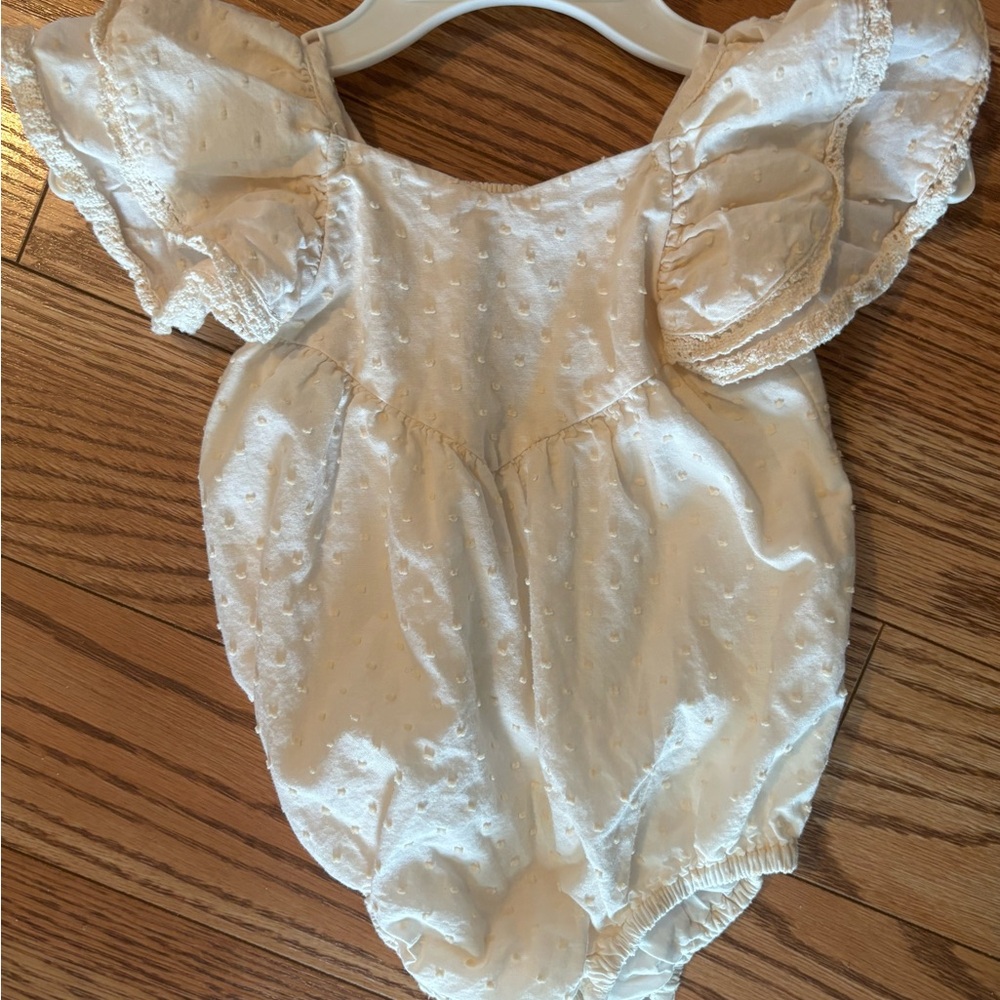 Cream Baby Romper with Ruffled Sleeves